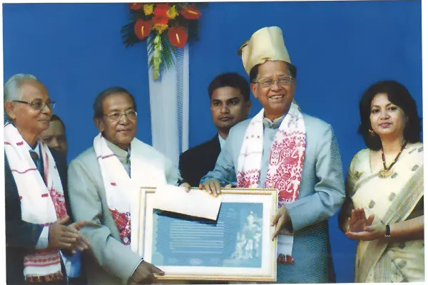 Prof Taid receiving the Sukapha Award from the Chief Minister of Assam, Shri Tarun Gogoi, for the year 2011-12.