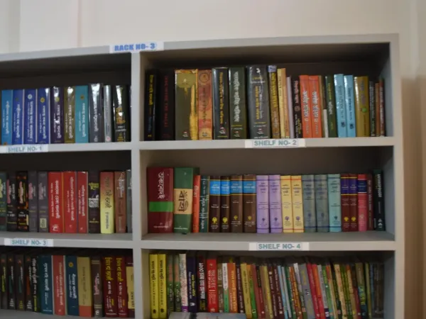 Reading areas, bookshelves, and visitors at the Tabu Ram Taid Memorial Library.