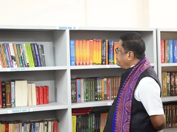 Reading areas, bookshelves, and visitors at the Tabu Ram Taid Memorial Library.